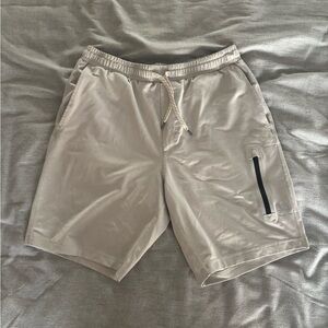 Vuori Men's Athletic Shorts in Light Beige